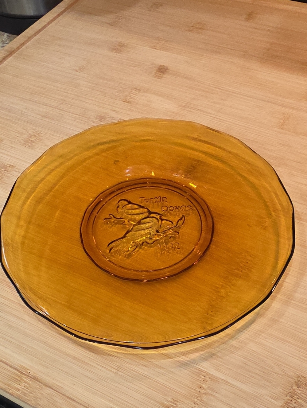 Tiara Amber Glass Dinner Plate with Embossed Fruit Motif.